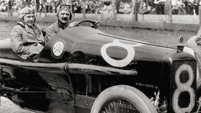 Louis Chevrolet is shown driving Durant around a track in this photo. 