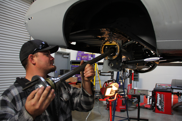 After bolting up the combo caliper mounting bracket and the parking brake assembly to the axle housing end (we are using a custom Chassisworks 9-inch), the axle shaft was inserted through the center hole of the caliper mounting bracket.