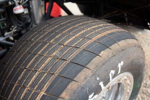 Cutting grooves on a diagonal on your front tires can help improve traction in the turns when the drive is hard on the wheel. After all, maximizing traction when the car is going down the straights and the wheels are pointed straight ahead isn't really the point.