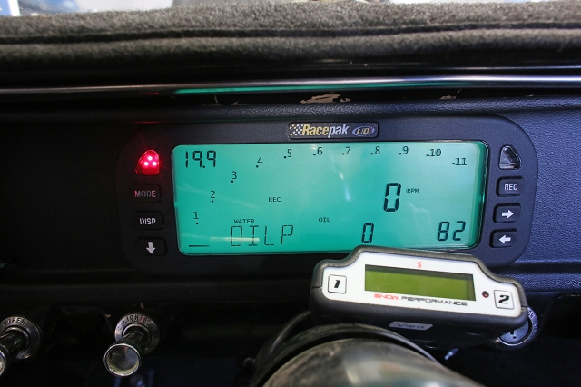 Our upgraded UDX Replay Dash, now with data logging capability, mounted up in our '65 Mustang. In the meter you can see the sweeping RPM tachometer readout, along with a digital readout of the engine RPM. At top left is our Air/Fuel ratio, while Water Temperature, Oil Temperature, and air Temperature are displayed in order along the bottom. Multiple pages can be programmed if you have additional sensors, allowing you to see every channel in real-time or Min-Max Recall Mode right no the dash.