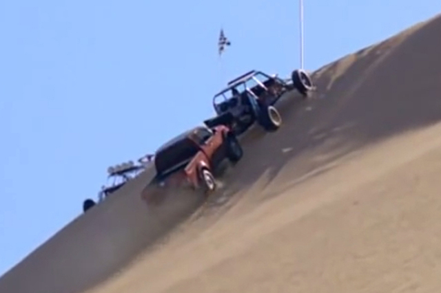 Nissan In Hot Water Over Ad Depicting Frontier Pushing Buggy Up Dune