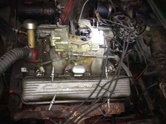 283 CI small block Chevy V-8, rated at 230 HP. The Holley carb and Edelbrock manifold will likely be traded.