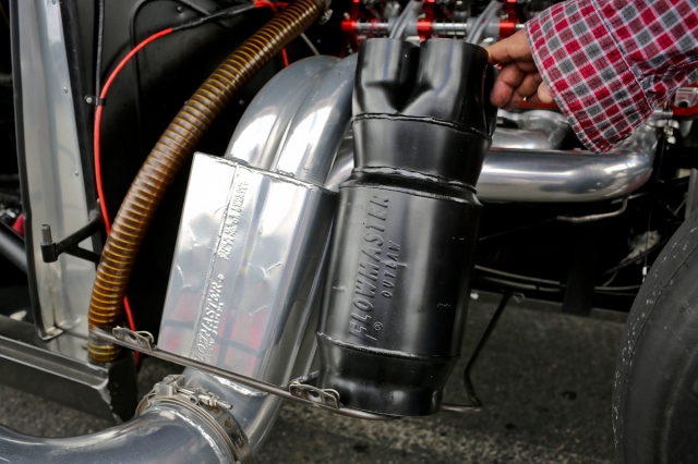 Here you can see the difference between the Scavenger collector muffler and the new Outlaw II. In the case of the Scavanger (on the car), Scialpi has modified the muffler to fit by cutting off the collector section at the inlet and welding the header pipes directly to the muffler case.