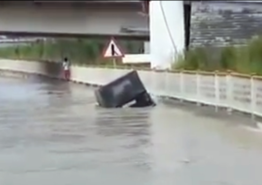 VIDEO: Russian Driver Attempts To Cross Flooded Street ... And ...