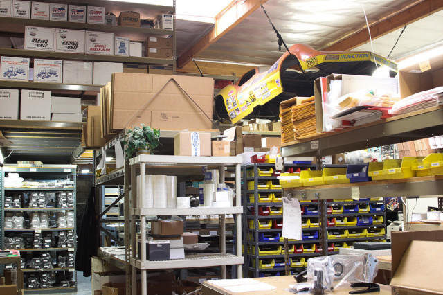 Good Vibrations stocks more than seven-figures worth of inventory of product at any given time, all neatly organized in their two neighboring buildings. Here, hanging above the warehouse area is one of Jim Mahers' former CIFCA Funny Car bodies.