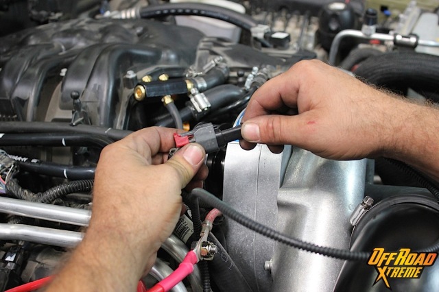 The alternator cable extension is plugged in.