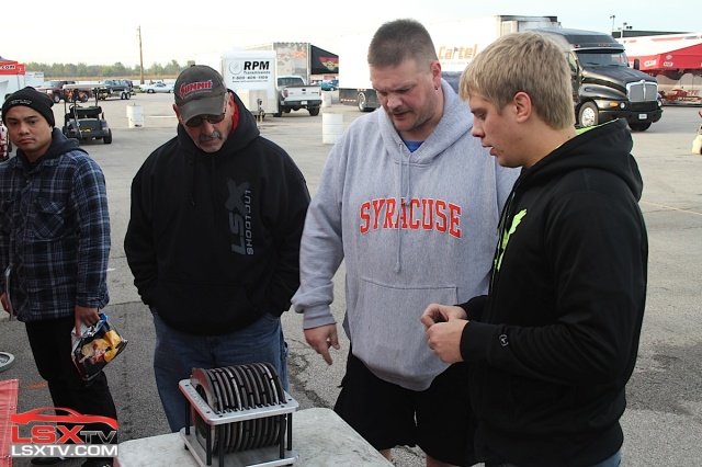 In the SAM pits, School of Automotive Machinists' student Zach Nelson (right) discusses the intricacies of Jud Massingill's All Motor Camaro's multi-plate clutch.
