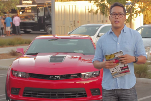 Edward Loh, editor-in-chief at MotorTrend, clutches the Best Driver's Car issue as a Z/28 awaits "fun time."