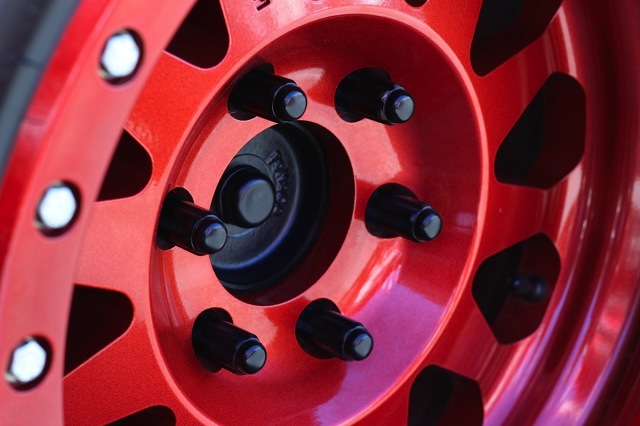 The red powder coat really makes the Method Race Wheels pop.