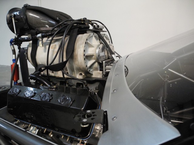 The massive PSI Supercharger sitting atop the BAE HEMI engine is pushing through the slick black paint scheme to cap off the menacing C7 style.
