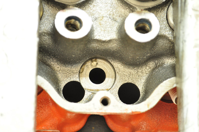 Problems can crop up in the most unsuspecting places; in this case, the head bolt recesses were leaking water. Powerhouse machined the areas causing the problem, and pressed in custom inserts secured by high grade sealant to solve the problem.