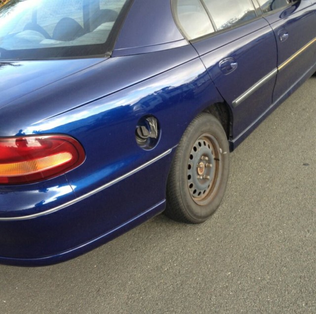 Missing fuel flap AND hubcap - a twofer!