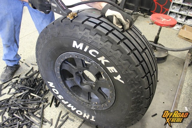 Frana applies a special groove pattern to the Mickey Thompson race tires.