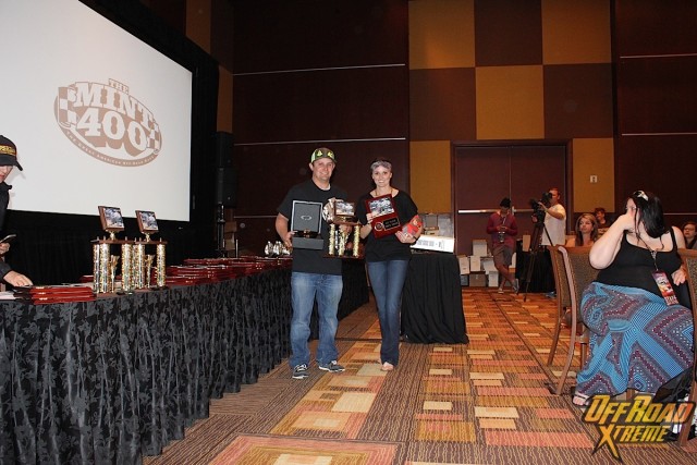 Justin Lofton and his wife pose with the awards.
