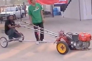 Video: Guy Rides Kubota Diesel Powered Chariot Down The Track
