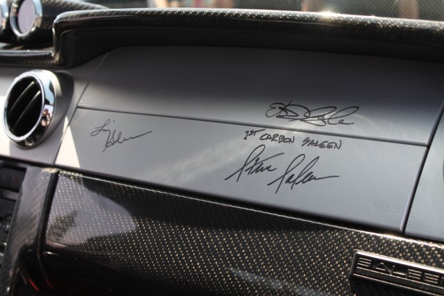 The three signatures on the Saleen's dash is Liz Salen, Steve Saleen, and Sigala's. 