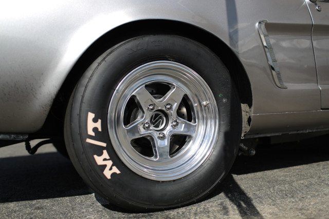 The new 3052R tire on our Project Biting The Bullitt 1965 Mustang. The radials are wrapped around JEGS Sport Star II 15x8-inch wheels, which are made from a cast A-356 alloy and CNC-machined with a polished finish.