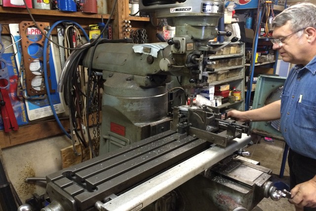 Fred Blue of Blue Performance machining a custom piston to fit the combustion chamber perfectly.