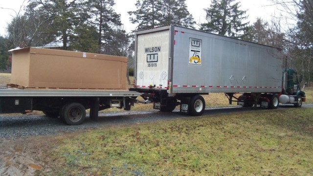 Payne taking delivery of the TMRC chassis kit and 1968 Camaro body at this D&T Motorsports shop in Virginia.
