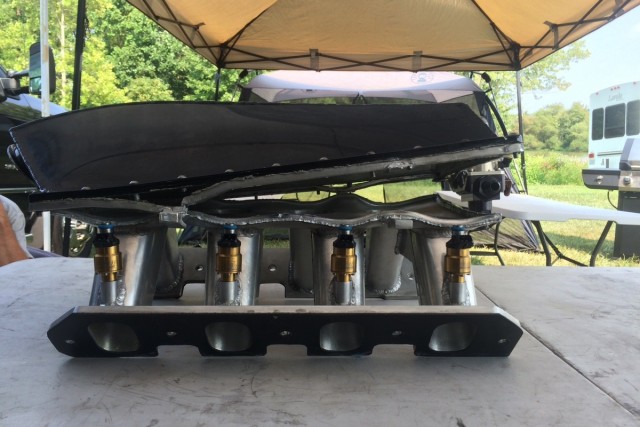 Well, with the car's re-release back into the racing world, Johnson is facing this issue at the YellowBullet Nationals this weekend. The intake couldn't quite handle the 50 pounds of boost from the twin Precision 94mm turbochargers. He was looking for an aluminum welder when we talked to him for this news item.