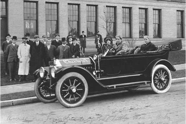 Chevrolet as a car company is born. Louis Chevrolet can be seen in this file photo from the GM Media History Center in the white coat. Billy Durant is at the far right of the spectators behind the first Chevrolet produced wearing the bowler hat.