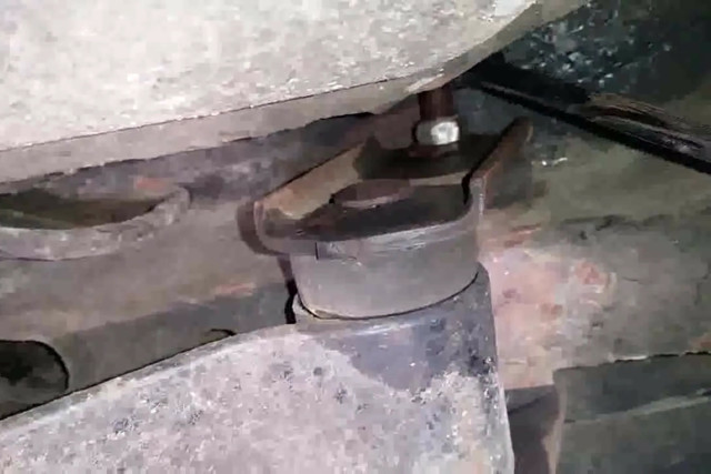 The upper shackle bolt is the last one to come out. Remember which side the nut is on.