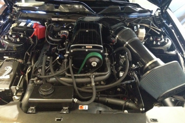 Mustang Performance Racing's Tim Eichorn and crew whipped up a 364-inch engine using a Sonny Bryant crank, Manley I-beam rods, and Diamond pistons. The headers were ported by Kris Starnes, and Bullet Racing cams were set in place before the newly-powdercoated cam covers were reinstalled. The Kenne Bell 4.7L supercharger sits atop the combo with a Mammoth intake. "This is the baddest modular engine I've ever built," MPR's Eichorn says.