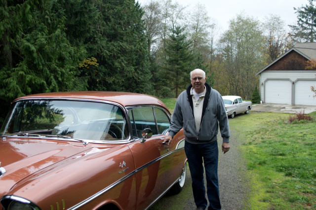 Ken standing next to his car.