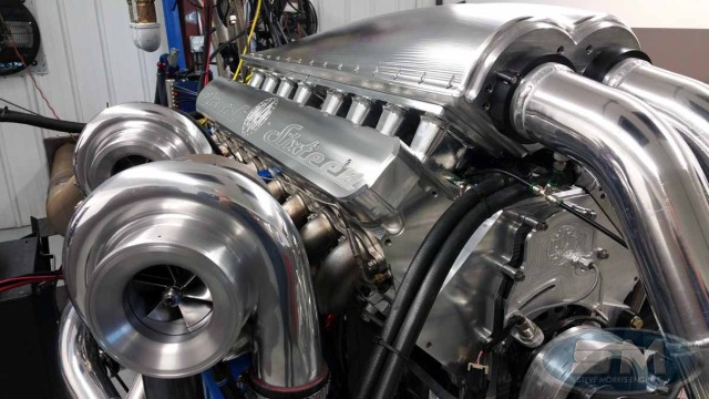 The massive mill is a sight to behold from any angle. Billet aluminum material is the order of the day on the cylinder heads, intake manifold, valve covers, engine block, crankshaft, connecting rods, camshaft, and even the timing cover. Even the compressor wheels on the turbos use billet construction. One has to wonder how much tooling met the end of its life on this insane project.