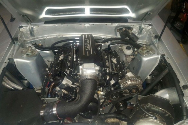 K-member is a UPR. Has a Fueltech FT500 EFI engine management system, with an Aeromotive belt drive fuel pump, and a Magnafuel regulator, Edelbrock rails that come with the intake. Air-to-water intercooler. Leash Electronics Boost Leash Controller and Pulse Leash.