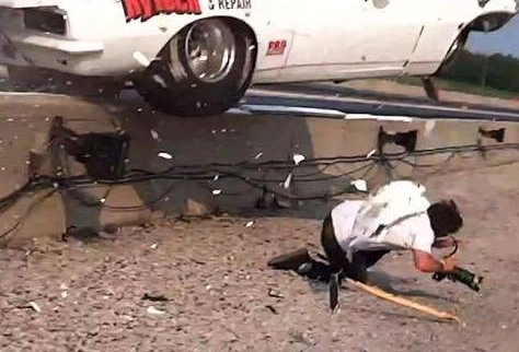 Video: Car Launches Over Wall, Nearly Crushes Photographer