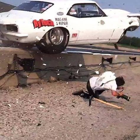 Video: Car Launches Over Wall, Nearly Crushes Photographer