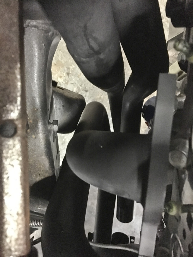 Due to the odd location of the engine, the headers required a bit more clearance to fit between the framerails. We nneded to notch the lower control arm mount to fit the headers.