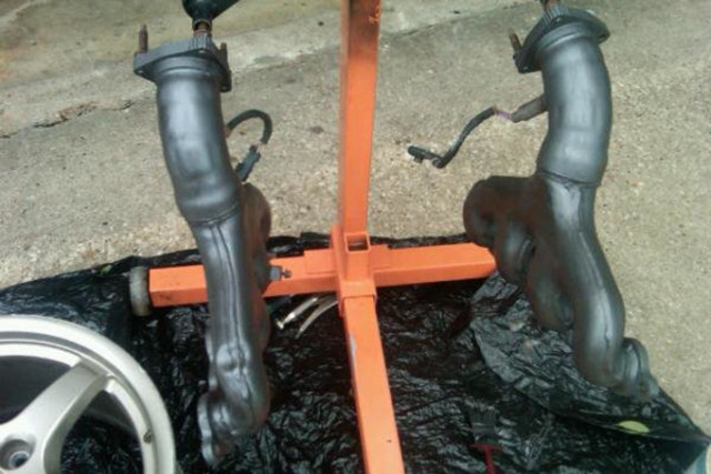 Rafael originally thought he was going to install these stock C5 exhaust manifolds. 