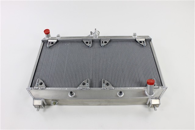 Be Cool's dual core radiator is some serious hardware, made from aircraft-grade aluminum here in the USA. It's a massive upgrade in capacity versus its OEM counterpart, which is a single core system that uses plastic tanks and some questionable build tactics. 