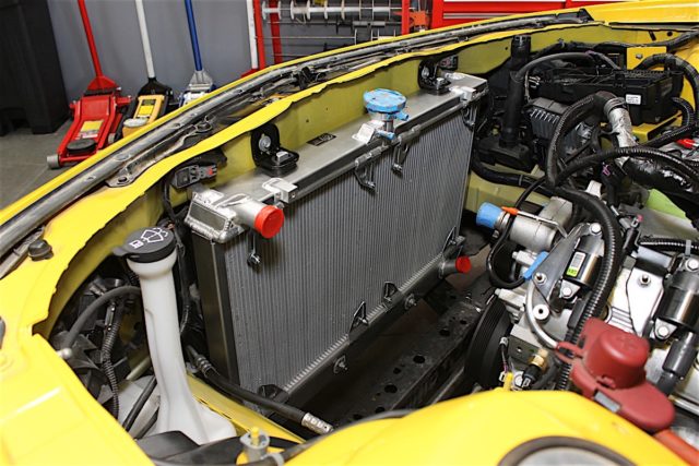It's important to note that there are some differences between the 2010-11 and 2012-15 Camaros that affect which radiator you'll need. For '12 models and up the mounting AC condenser and fan was relocated, so while the radiators are the same, the bracketing is not. We ended up with a 2010-11 model by mistake but we were able to fabricate and weld on some mounts to solve the problem in the interest of saving time. However, if we'd had the right part on hand, this radiator would drop right in in exactly the same manner as the stock one did. 