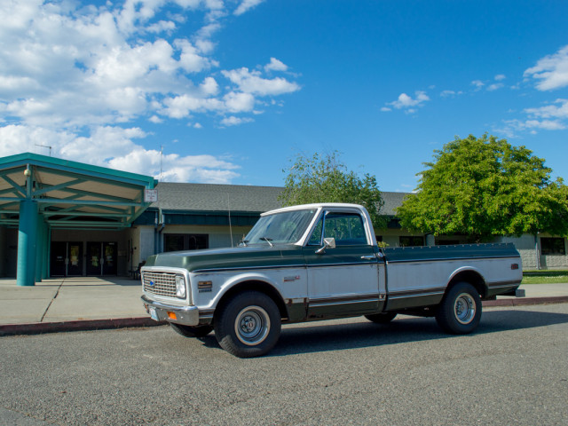 Mr. Evans' truck parked outside the school where he works.