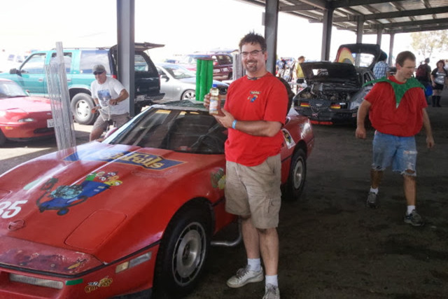 Ricks hold a bottle of CorVegge's fuel: Vegetable oil. Image courtesy Rick Chesavage. 