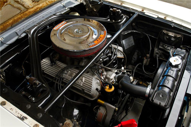 Shelby helped distinguish the GT350's 289ci V8 from the standard K Code 289 with a cast aluminum oil pan and valve covers, along with an aluminum intake pulled from the 289 Cobra parts bin, which was topped with a 715 CFM Holley four-barrel carb and an open element air cleaner. Image: Barrett Jackson