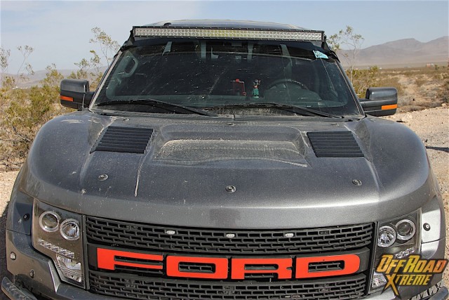 The flared fiberglass fenders from FiberworX give Young's F-150 an even beefier stance than the factory-built Raptor. Jeff says if he had to do it again he'd likely have gone with the factory Raptor grill rather than the aftermarket piece you see here, but we see no reason to deduct any points here from a visual standpoint.