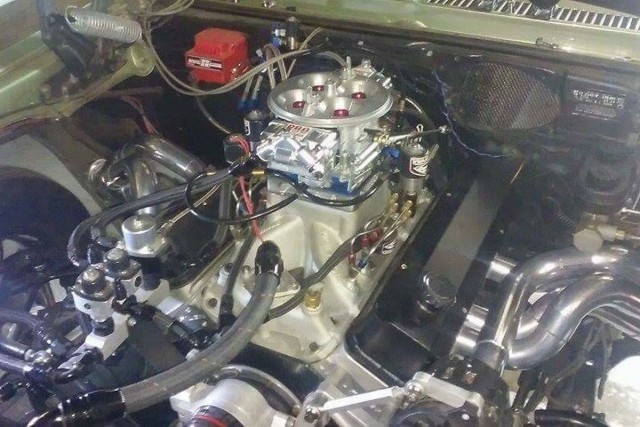 The current combination in the car is a 421-inch small block with an Edelbrock Super Victor intake, Pro Systems carburetor, and Induction Solutions nitrous system. The fender exit headers one of the newest additions to the Nova.
