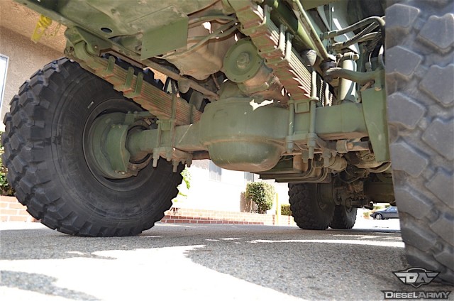 The truck's suspension design consists of leaf spring front end and floating tandem rear axles. Generally full floating designs are reserved for vehicles that are designed for severe duty, or are intended to carry heavy loads. This type of axle uses an axleshaft on each side that is either splined at both ends or splined on the inner end and has a drive flange on the outer end.