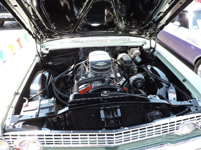 The "W" motor in the Impala, nice, clean installation.