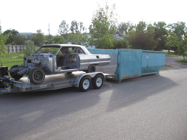 There were times in the seven year build Denny felt like quitting. He backed the trailer up to this dumpster but thought better of it.