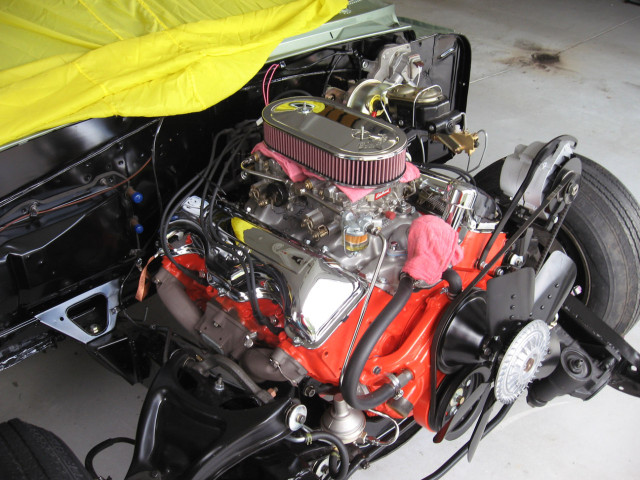 The ultimate 1963 engine sitting in the rebuilt frame. Dual fours are a rare option and the chromed valve covers add a bit of spice.