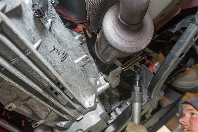 The stock catalytic converters. Notice the large size of the converter.