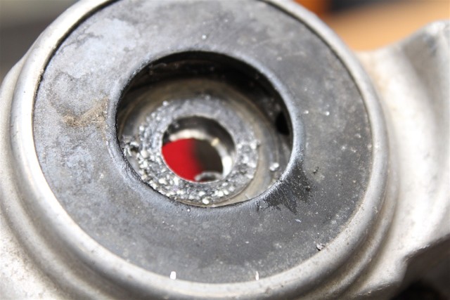 The hole in the stock upper shock mount should be drilled to 12mm.