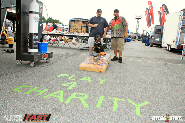 Bric Briehan from ARC and Steve Kanner from Commando Racing are with Diesel the Rottie representing and raising money for charity with a bean bag toss event in the manufacturers midway. All proceeds go to the American Cancer Association and the American Diabetes Association. 