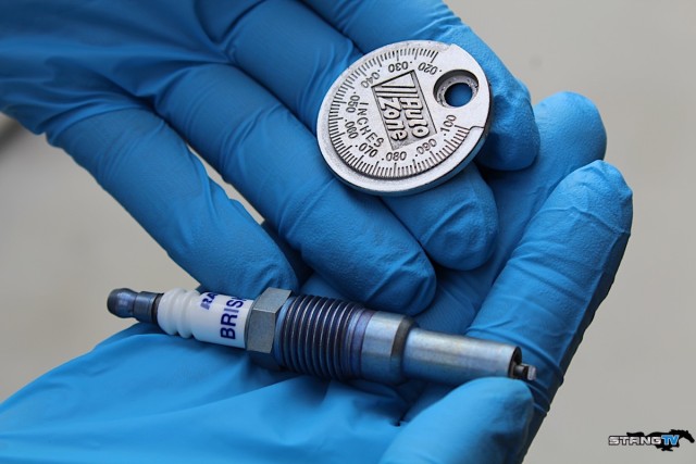 Luckily for us, our new Brisk Racing silver spark plugs are easy to gap thanks to a traditional electrode style. We gapped our plugs to .35 per Vortech and Brenspeed's recommendation for our soon-to-be supercharged 3-Valve.