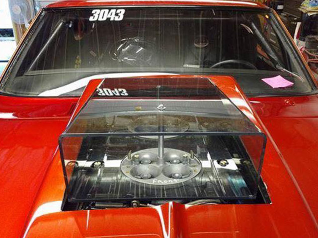 A close-up look at one of Innovative Racecraft's lexan scoops, installed and ready to hit the track. If your engine just barely fits under your hood, or doesn't fit at all, a clear lexan scoop is definitely a great compromise to provide your engine fresh air without having to install a huge pro mod-style scoop on your more street-appearing hotrod.